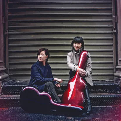 Beijing Guitar Duo publicity photo (outside in front of garage door)