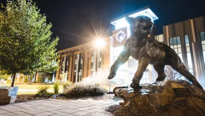 NMU Wildcat statue outside of Jamrich Hall.