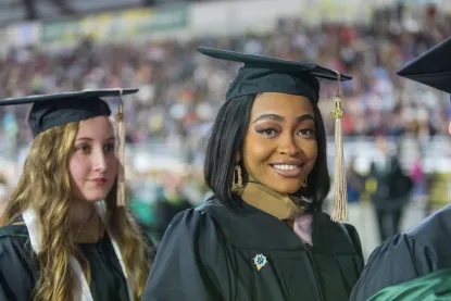 Female graduate student at NMU commencement