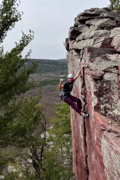 Michaline rock climbing