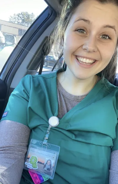 Emma Carey, woman in nurse scrubs