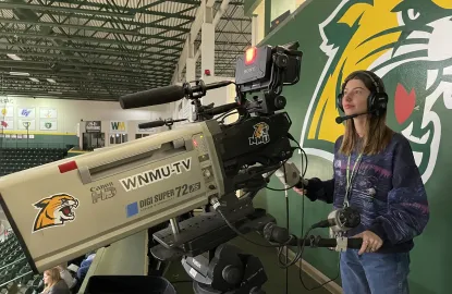 Megan on the camera during an NMU Sporting event