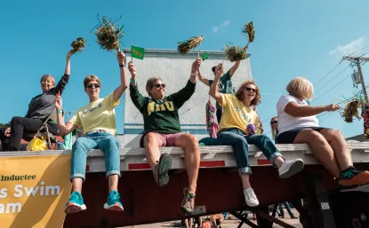 Women on a float with poms