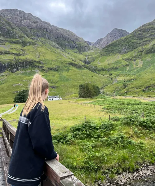 Student overlooking mountains in Scotland