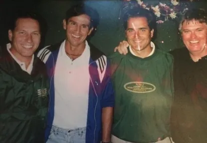 Old photo of four male college friends