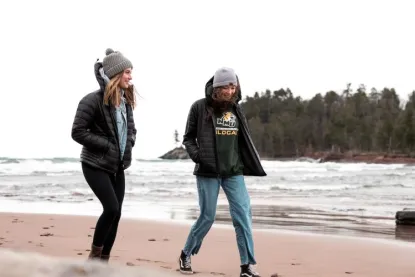 NMU Students walk on the beach at Little Presque Isle, north of Marquette.