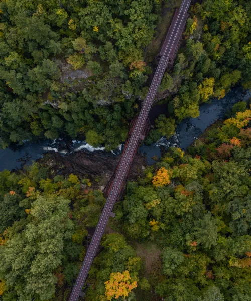Aerial photo of a train track over a river
