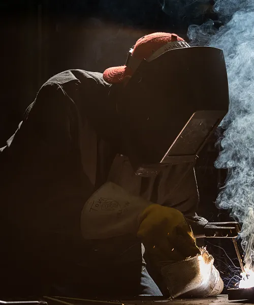 Student uses welding torch