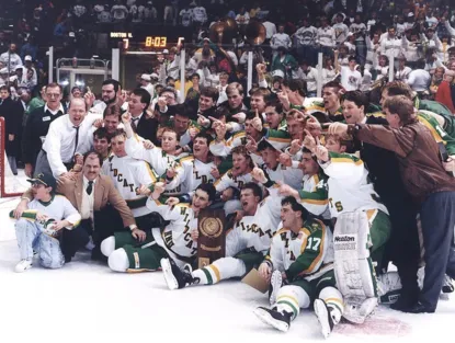 Group shot of Northern Michigan Hockey Team and coaches in 1991 on the ice after winning the 1991 NCAA championship