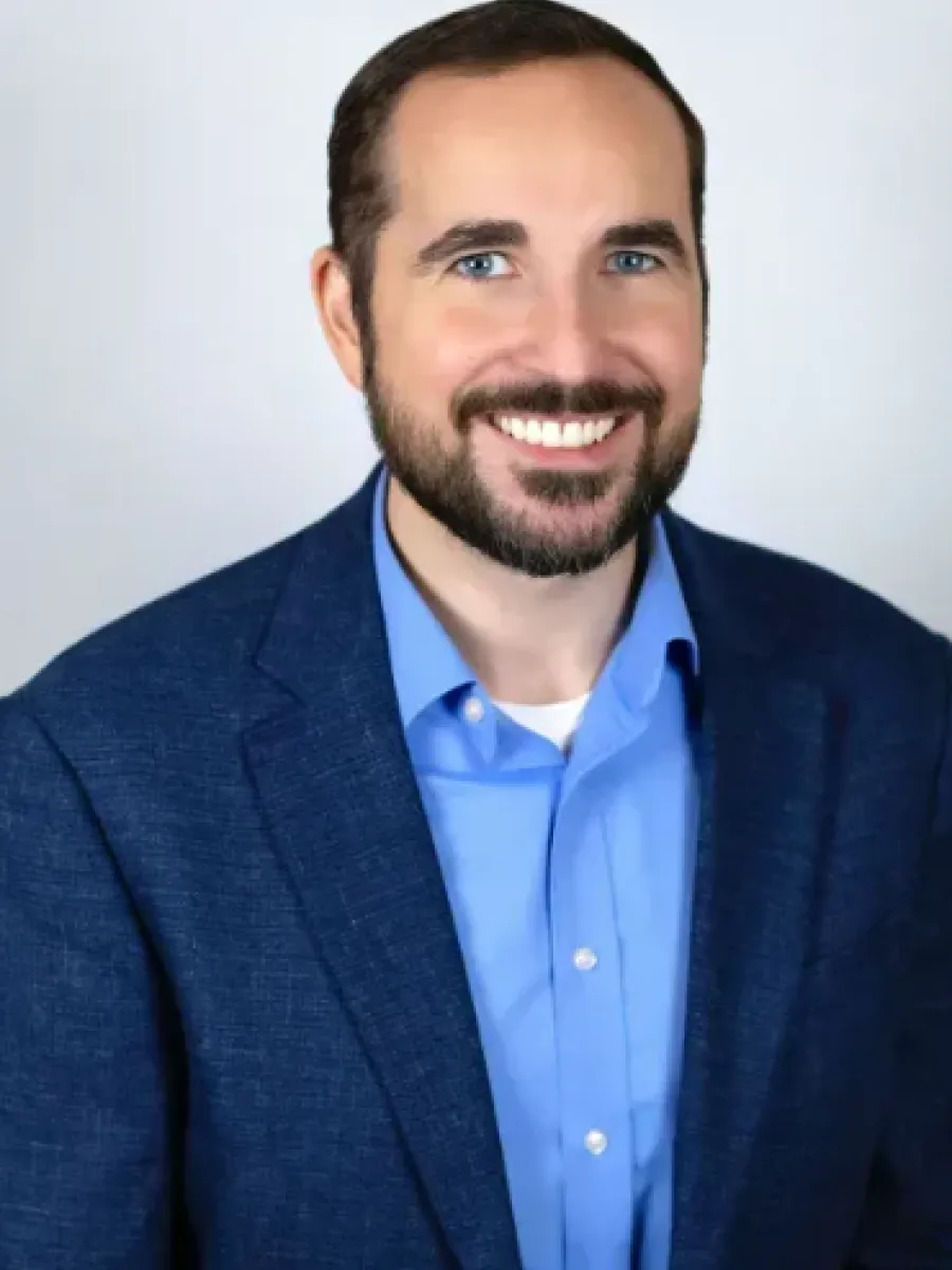 Josh Sanitago headshot on light gray background