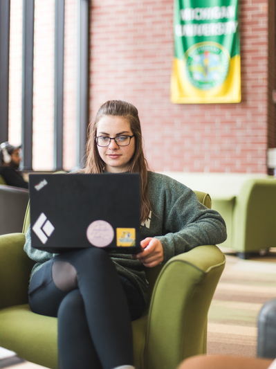 Student on laptop in Jamrich Hall