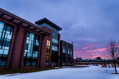 Snow on ground at NMU behind sunset