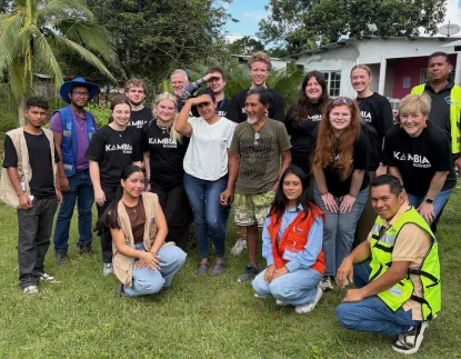 A group of students and faculty pose with Panama locals on a study abroad trip 