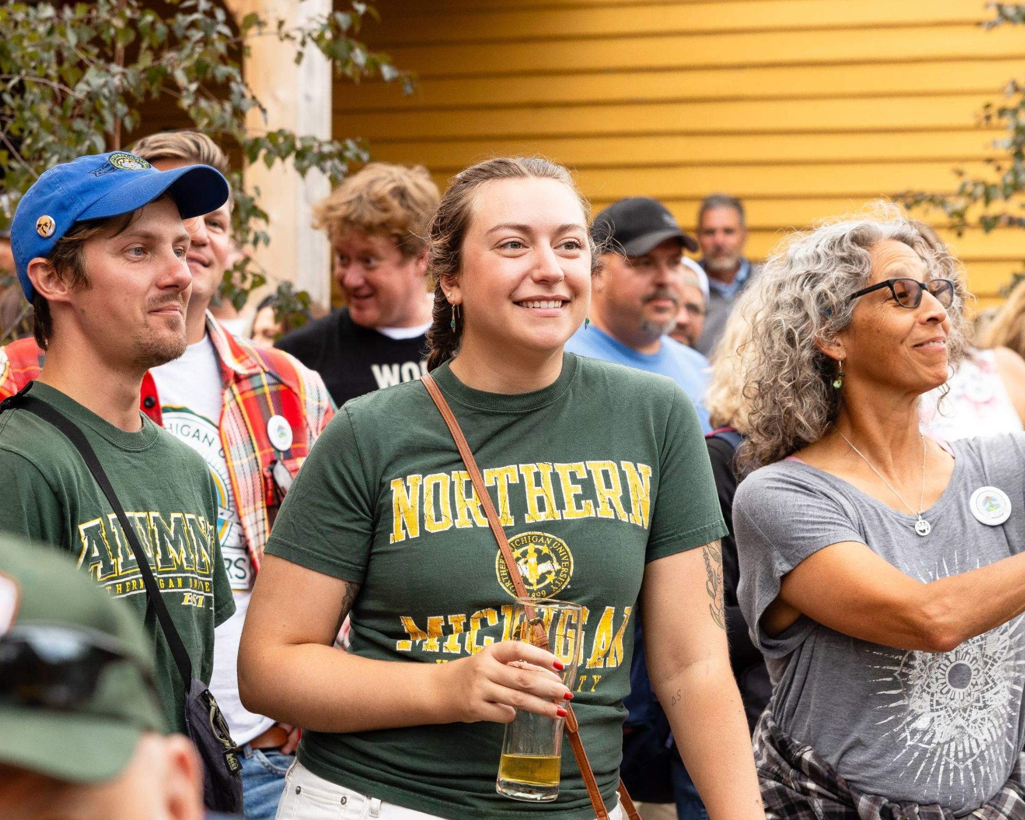 A crowd in NMU gear looks on as they enjoy Alumni Happy Hour at Blackrocks Brewery