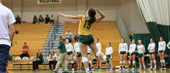 NMU Volleyball Player Serving