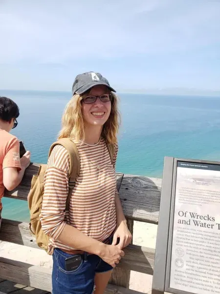 Samantha Pynnonen posing near Lake Superior