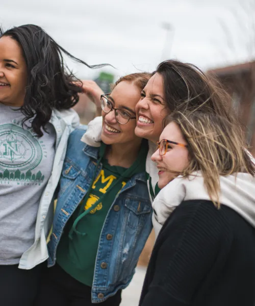 Group of NMU students posing for a photo on the academic mall