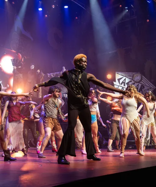 College students on stage during a theatre production