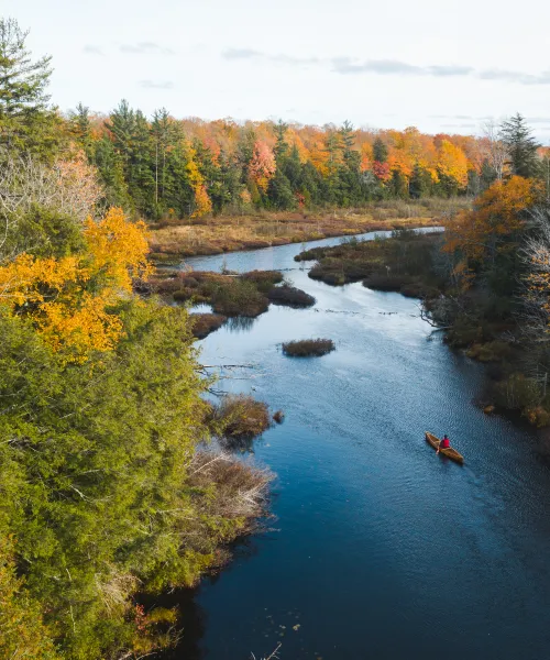 Canoeing on a river in the fall
