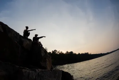 Sunset at Wetmores with two shadow silouhettes pointing off into the distance