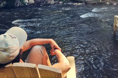 Person looking out over a river