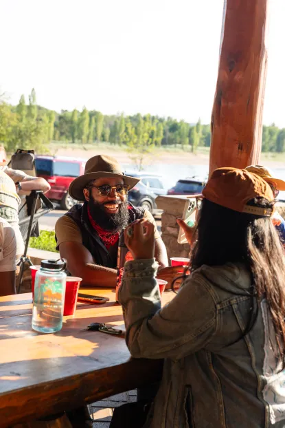 Two people talking at the Presque Isle Pavilion, in Marquette
