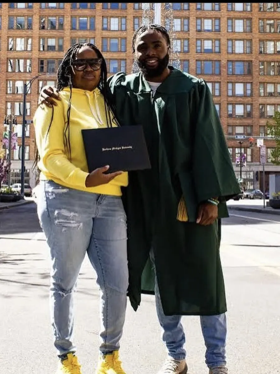 Keshawn and his mom with his diploma