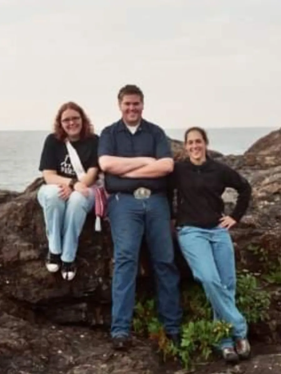 Three people on rocks