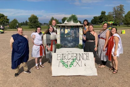 Students dressed in togas for the homecoming parade