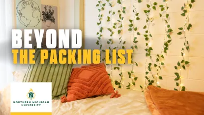 "Beyond the Packing List" Northern Michigan University - Picture of a bed made with throw pillows