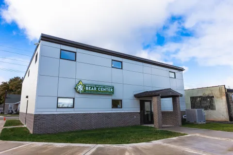 Exterior view of NMU’s Behavioral Education Assessment and Research (BEAR) Center, featuring the building’s entrance and signage.