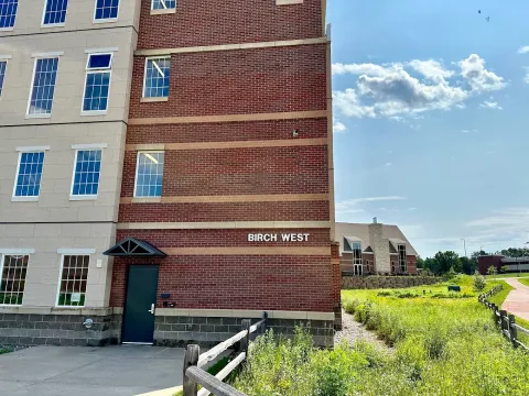 Birch West is a four story brick building.