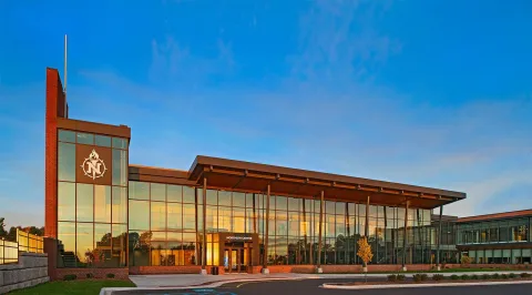 The Northern Center is a brick building featuring large modern windows.