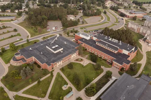 Aerial view of a the Science Building and Weston Hall, two brick buildings.
