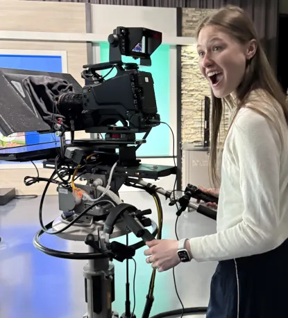 Student running a camera