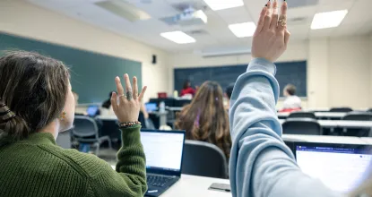 Students with hand up