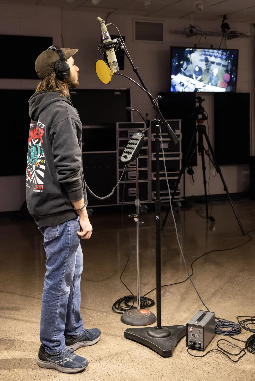student singing into a mic