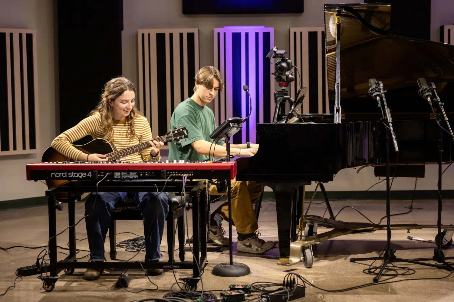 students play pianos