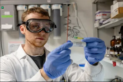 Luke Horne in the stockroom checking the pH