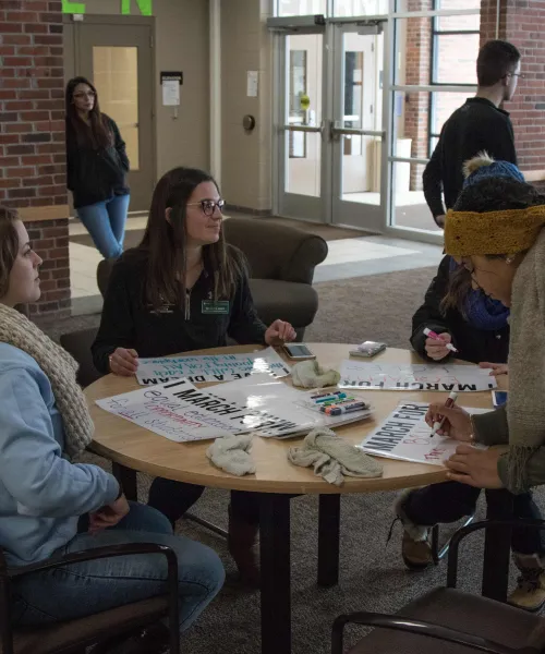 Students filling out MLK I March For signs