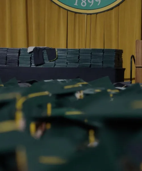 Graduate Caps in front of the commencement stage