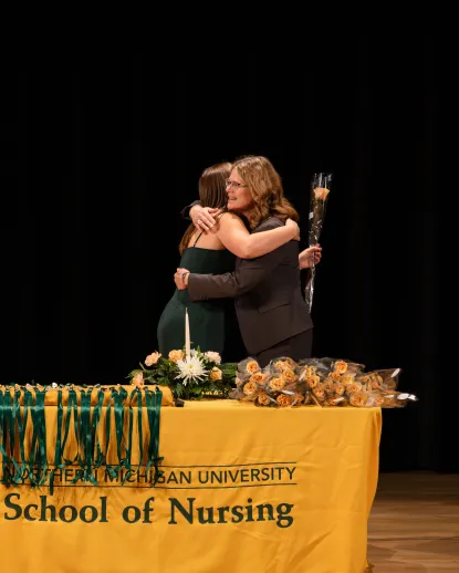 Student receiving flower at Nursing Ceremony
