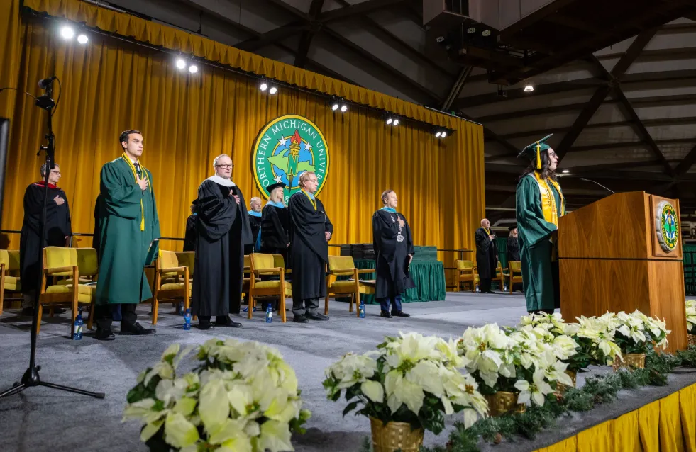 Speakers on stage at commencement