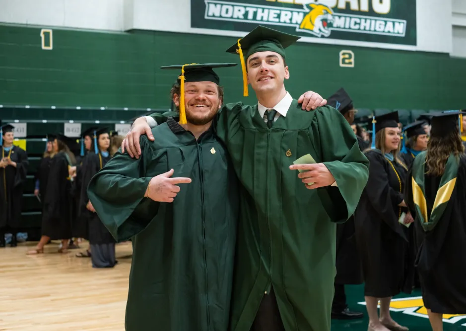 Two students posing for a photo before marching to the Dome