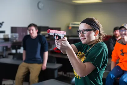 Students using a gun simulator