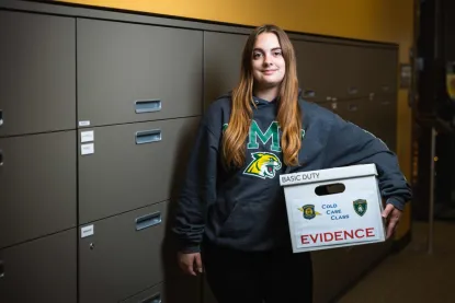 female holding an evidence box