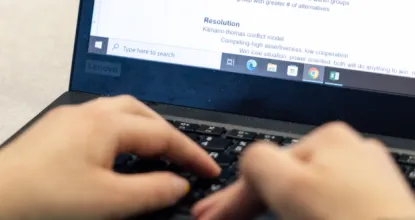 Hands on laptop computer keyboard