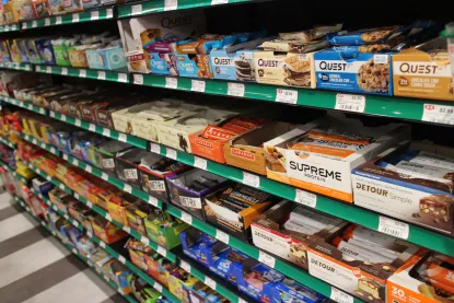 Protein bars in boxes on the shelves in Cat Trax