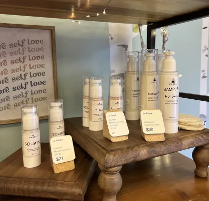 Skincare products sitting on wooden platforms in Sundre