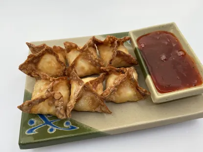 Crab wontons from Temaki on a white background